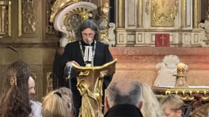 A church leader speaks from a pulpit during an ecumenical Prayer for Home service in the Czech Republic